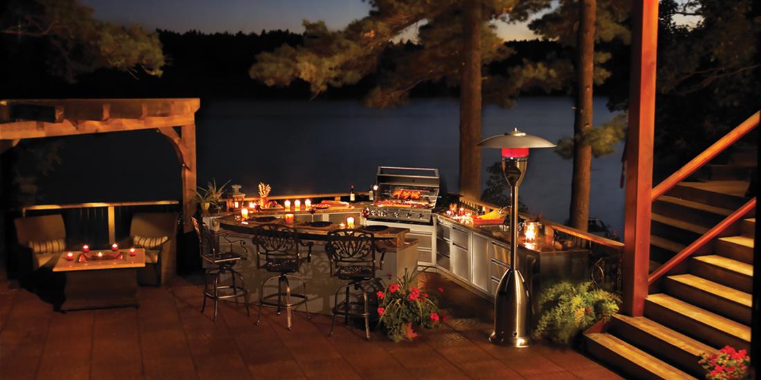 Outdoor kitchen at night. Photo courtesy Napoleon Grills.