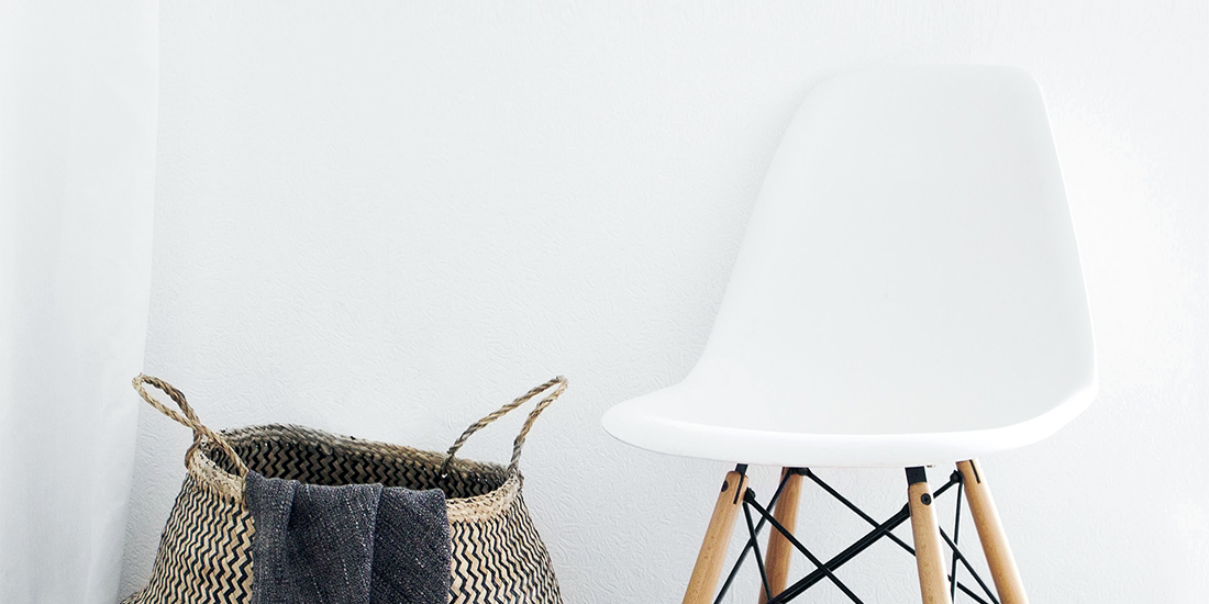 Chair and basket against a smooth wall