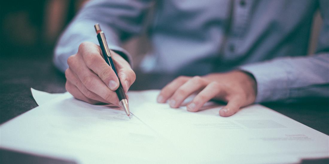 Man signing a document